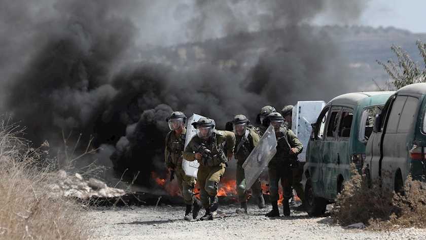 Iranpress: Five Palestinians and a foreign activist shot, injured by Israeli forces